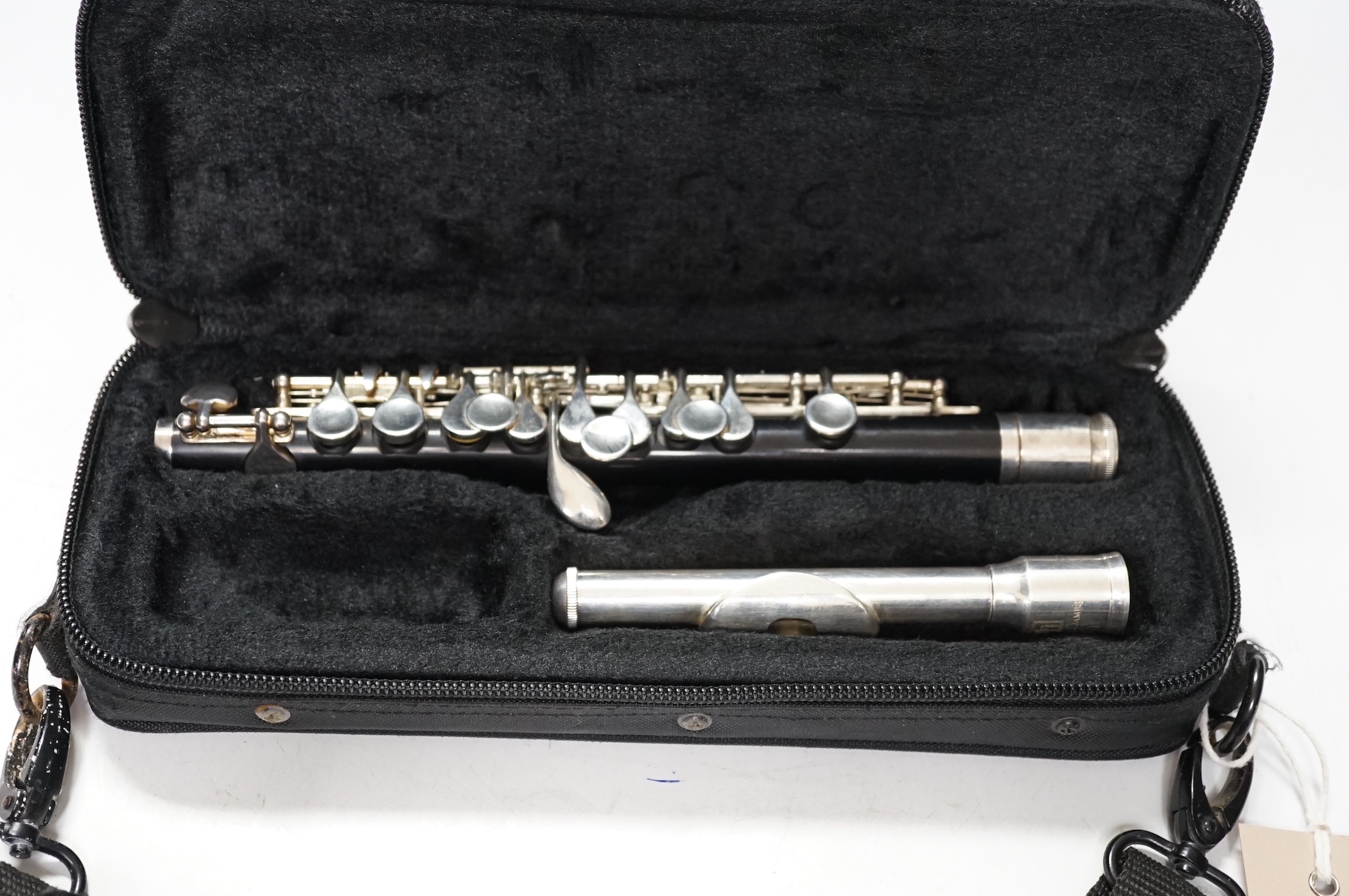 A cased Trevor James student’s piccolo, P1